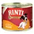 Konzerva Rinti Gold, text: Mit feinen Stückchen vom Huhn, obrázok psa na etikete. Text v nemčine.