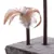 Close-up of a cat tree base with a brown post and attached feather toy. Feathers are light brown and white, fixed to the top of a short post on a grey faux fur platform.