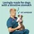 Text reads: Lovingly made for dogs with a sensitive stomach. Vet approved. Image shows a person in medical scrubs holding a dog.