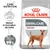 Royal Canin Dental Care Medium pour chien, texte visible : Réduit la formation de tartre, résultats prouvés réduction du tartre jusqu’à 99 %. Chien illustré sur l’emballage.