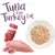 Tuna it on. Turkey it up. Shown: raw tuna fillet, turkey meat and shredded meat on a plate.