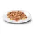 Close-up of meat pieces in jelly on a white plate, shown as an example of the consistency and appearance of the pet food.