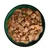 Chunks of meat with peas and carrots in gravy served in a bowl, showing the texture and ingredients of the wet pet food.