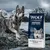 Sac de croquettes Wolf of Wilderness Raw Taste Scandinavian Fjords, sans céréales ni pommes de terre, avec un chien devant un paysage nordique. Texte visible : 100 % grain-free & potato-free recipe.