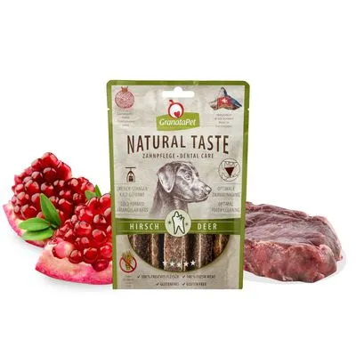 GranataPet Natural Taste Dental Care hondensnack, zichtbare tekst: hert, 100% vers vlees, glutenvrij. Afbeelding van granaatappel en stuk rauw vlees naast de verpakking.