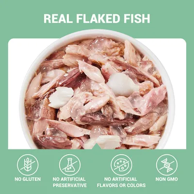 REAL FLAKED FISH. NO GLUTEN, NO ARTIFICIAL PRESERVATIVE, NO ARTIFICIAL FLAVORS OR COLORS, NON GMO feliratok angol nyelven, tálban haldarabok láthatók.