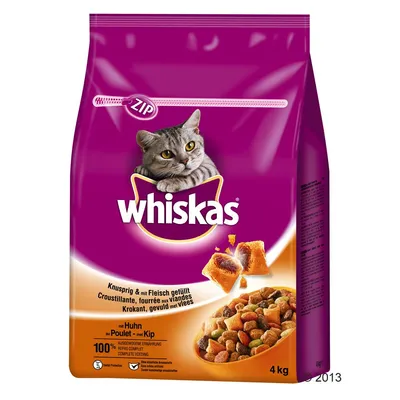 Whiskas suha hrana za mačke, piščanec, 4 kg. Na embalaži: 'Knusprig & mit Fleisch gefüllt', 'mit Huhn', '100 % ausgewogene Ernährung'. Slika briketov in polnjenih koščkov.