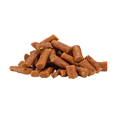 Brown, elongated dog snacks in piece form, visible without packaging.