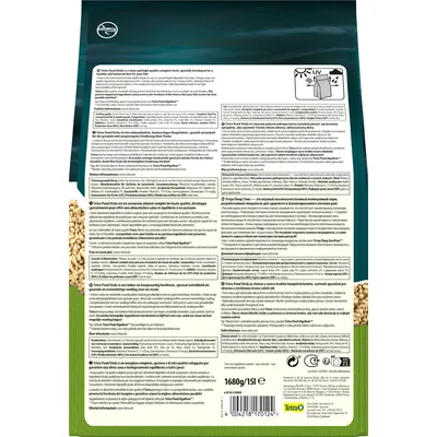Retro confezione Tetra Pond Sticks, testo multilingue su ingredienti e istruzioni, simboli di riciclaggio, peso netto 1680 g/15 l, codice a barre, marchio Tetra visibile in basso.