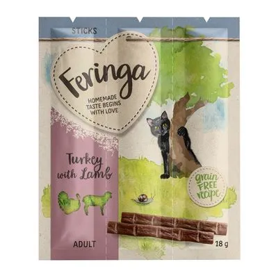 Feringa Sticks Turkey with Lamb, Adult, 18 g. Tekst: 'Homemade taste begins with love', 'grain free recipe'. Afbeelding van zwarte kat bij boom en drie sticks.