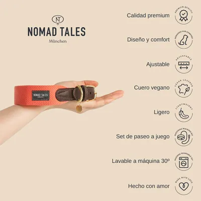 Collar Nomad Tales München naranja con hebilla metálica y etiqueta visible, sostenido en una mano. Texto: calidad premium, diseño y comfort, ajustable, cuero vegano, ligero, lavable a máquina 30º.