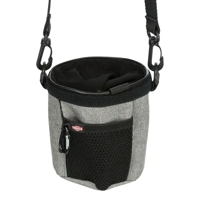 Trixie treat pouch made of grey fabric with black mesh pocket, zip and carabiner. Adjustable shoulder strap visible.