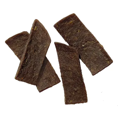 Four brown, rectangular dog snacks with a smooth surface and visible grains.