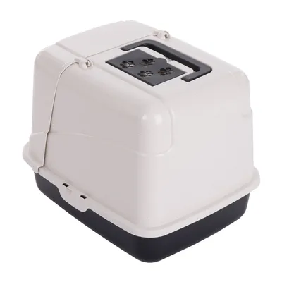 Katzentoilette mit Haube, Tragegriff und Belüftungslöchern in Pfotenform auf der Oberseite, Unterteil schwarz, Oberteil weiß.