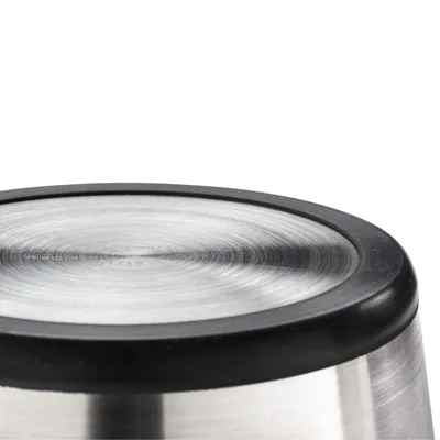 Stainless steel dog bowl with non-slip rubber base, detailed view of underside.