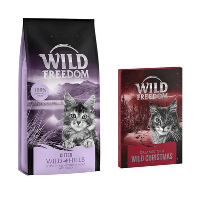Balení Wild Freedom Kitten Wild Hills 6,5 kg s textem '100% grain-free recipe' a krabička Wild Freedom Dreamin' of a Wild Christmas 85 g. Obě balení s obrázkem kotěte.