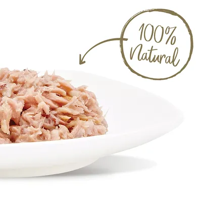 Lautasella annos vaaleaa, revittyä lihaa. Kuvassa teksti: 100% Natural.