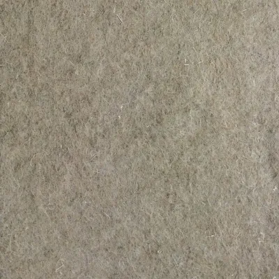 Närbild av en beige-brun filtstruktur, materialets yta synlig.
