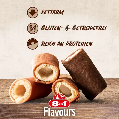 8in1 Flavours. Nizka vsebnost maščob, brez glutena in žit, bogato z beljakovinami. Prikazani so polnjeni pasji priboljški v rjavi in bež barvi.