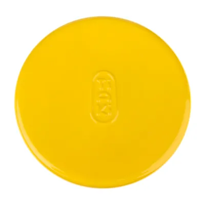 Yellow round lid with embossed 'Trixie' lettering.