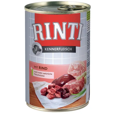 RINTI Kennerfleisch dåse med teksten 'MIT RIND' og 'noch mehr natürliche Fleischstücke', billede af oksekød og kødterninger på etiketten.