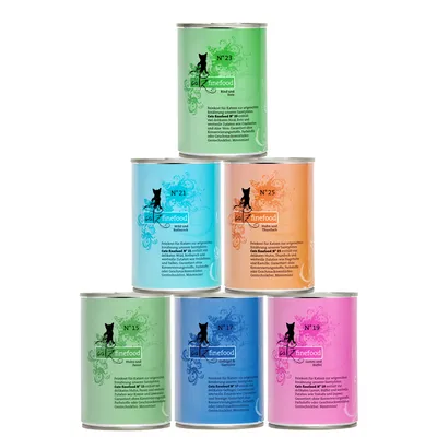 Кутии с храна за котки catz finefood, различни цветове и номера: №15, №17, №19, №21, №23, №25. Видими са етикети с текст на немски език.