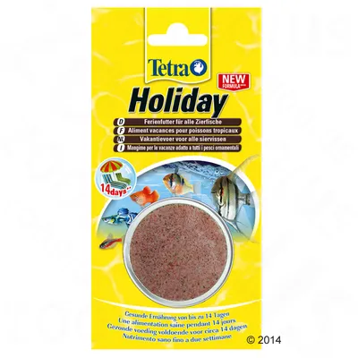 Tetra Holiday - loma-ajan ruoka koristekaloille, pakkauksessa näkyy pyöreä ruokapala ja teksti '14 days*', useita kieliä, keltaisella taustalla kuvia akvaariokaloista.