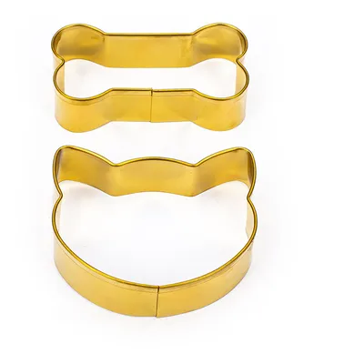 Two gold-coloured metal cookie cutters, one bone-shaped and one cat head-shaped.