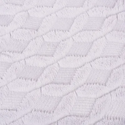 Nahaufnahme eines weissen Stoffes mit geometrischem Strickmuster, geeignet für Heimtierbedarf oder Dekoration.