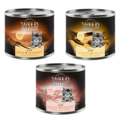 Trzy puszki Wild Freedom Kitten 200 g: Wide Country Chicken with Veal, Golden Valley Chicken with Rabbit, Great Desert Chicken with Turkey. Widoczny napis: 100% grain-free recipe.