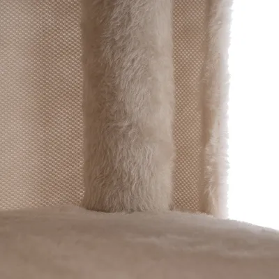 Close-up of beige plush fabric and textured material, possibly part of a scratching post or pet furniture.