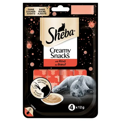 Sheba Creamy Snacks mit Rind au Boeuf, 4 x 12g. Ohne Zuckerzusatz, sans sucre ajouté. Cat image and bowl of creamy snack on front. Feeding by hand symbol visible.