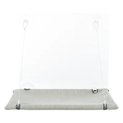 Couchage gris pour animal avec support rigide transparent, fixé par quatre ventouses visibles aux coins. Matériaux visibles : tissu et plastique.
