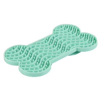 Benformad, mintgrön silikonmatta med vågstruktur och små knoppar, lämplig för långsam ätning eller sysselsättning.