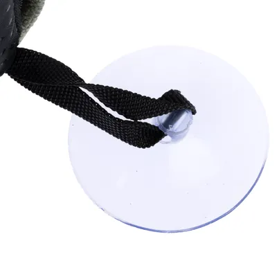 Närbild av en transparent sugpropp med svart band, lämplig för att fästa tillbehör.