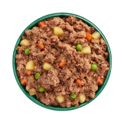 Bowl filled with wet pet food containing visible chunks of potato, carrot and green peas mixed in meat.