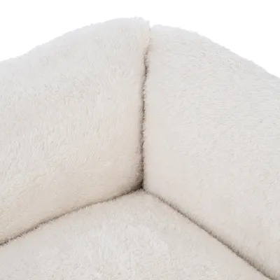 Close-up of a white, fluffy material used as padding for a product.