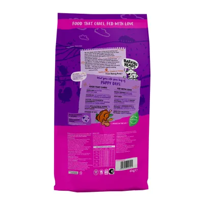 Product packaging showing feeding guide, nutritional information, and key ingredients for puppy food. Includes details on grain-free recipe, salmon oil, calcium, and natural health benefits.