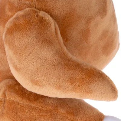 Close-up of a brown plush toy with soft texture and visible ear.