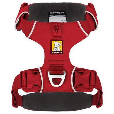 Ruffwear dog harness in red with reflective stripes, ID pocket and sturdy buckles. Logo with dog image visible.