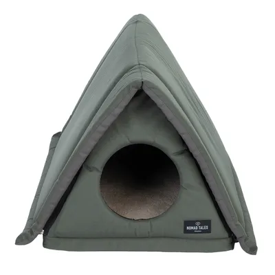 Nomad Tales tienda para mascotas en verde con entrada redonda y acolchado interior suave.