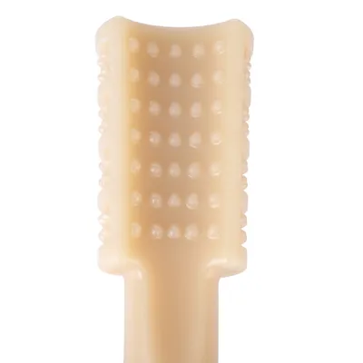 Beige tyggepind med knopstruktur til tandrensning og tyggeoplevelse.