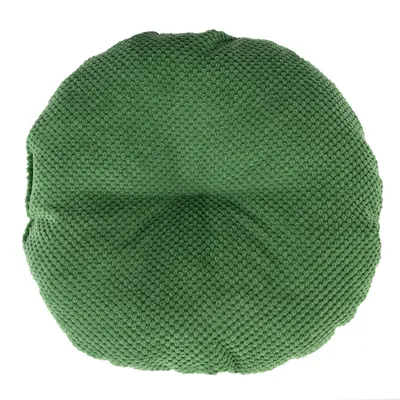 Cuscino rotondo verde con superficie strutturata in tessuto. Adatto come accessorio o decorazione.