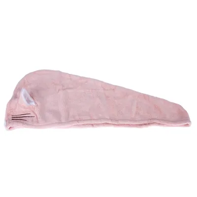 Roze pluchen speelgoed in de vorm van een muis met geborduurde snorharen en witte oren.