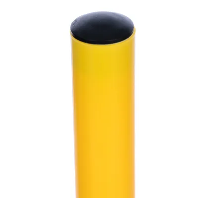 Yellow cylindrical object with black cap, possibly part of a product or accessory.