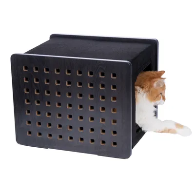 Black cat cave with square ventilation holes, cat stretching paw out of the entrance.