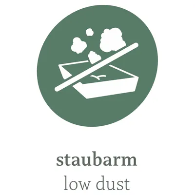 Staubarm. Symbol für eine staubarme Katzenstreu mit durchgestrichenen Staubwolken über einer Streuschale.