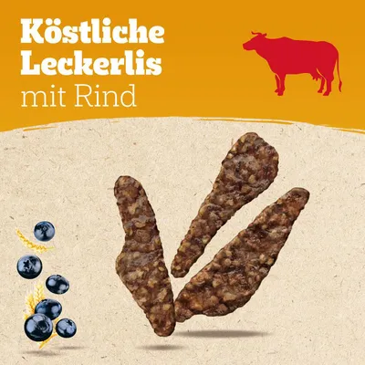 Köstliche Leckerlis mit Rind, dargestellt mit roten Kuh-Symbol und Zutaten wie Blaubeeren und Getreide.
