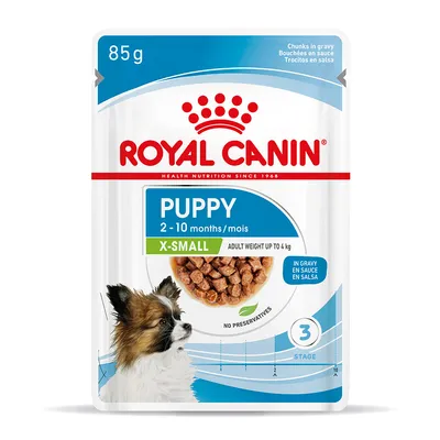 Royal Canin Puppy X-Small 2–10 months, 85 g, bouchées en sauce, poids adulte jusqu’à 4 kg, sans conservateurs, illustration d’un petit chien et croquettes visibles sur l’emballage.
