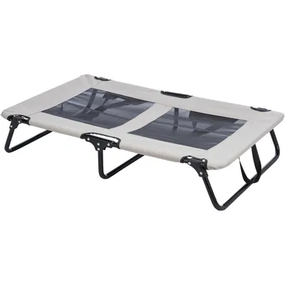 Приподнятая лежанка с металлическим каркасом и сетчатой тканью, прямоугольная форма, бежевый цвет.